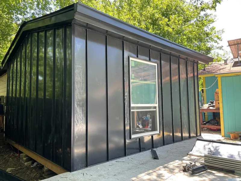 Black standing seam metal wall panels for Metal Roof Installation in Swansea